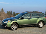 2013 Subaru Outback with new transmission parked outdoors against a scenic background