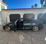 2015 Audi A5 in grey with black interior, featured for sale, showcasing sleek design and luxury features.