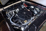 Engine compartment of a restored 1963 Lincoln Sedan with original parts and pristine condition