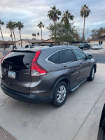 2013 Honda CR-V EX FWD parked, showcasing sleek design and maintained condition, ideal for buyers seeking reliability.