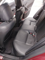 Interior view of a 2006 Lexus IS 250 RWD with immaculate leather seats and spacious backseat.