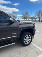 2015 Chevrolet Silverado 1500 Z71 LT side view, showcasing alloy wheels and off-road tires.