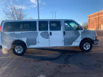 2006 Chevrolet Express 3500 passenger van in good condition, white exterior, low mileage, ideal for road trips or work.
