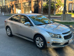 2016 Chevrolet Cruze LS in silver parked, featuring clean title, automatic transmission, and 130,000 miles.
