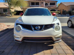 Front view of a clean Nissan Juke Nismo, 109,000 miles, featuring a turbocharged engine and strong manual transmission.