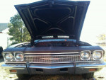 1968 Chevrolet Chevelle with hood open, showcasing its strong V-8 engine and classic design.