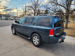 2007 Nissan Armada in great condition with a V8 engine and luxurious leather interior parked outside.