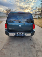 Rear view of a 2007 Nissan Armada in great condition, showcasing powerful build and clean title.