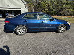 2003 Honda Accord in blue color, showcasing side view and details of tires and body condition.
