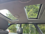 Interior view of a 1999 Subaru Outback with sunroofs and leather seats.