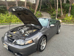2003 Ford Mustang Cobra convertible with open hood, showcasing engine, excellent condition, only 18,000 miles.