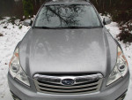 2010 Subaru Outback in silver, senior-owned, 59000 miles, parked in snowy outdoor setting