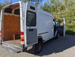 2004 Dodge Sprinter 3500 van with open doors, showing the cargo space and exterior details.