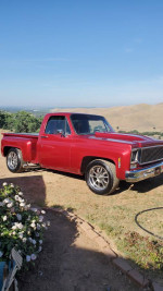 1975 Chevy C10 Stepside truck with a 383 stroker engine and custom wheels parked outdoors