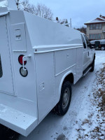 2016 Ford F-350 Supercab 4x4 with enclosed service body in snow.