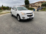 2011 Chevrolet Equinox LT with leather interior and backup camera, parked in a residential area.