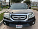 Front view of a black 2011 Honda Pilot EX FWD with excellent condition and no visible damages.