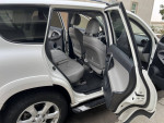 Interior view of 2012 Toyota RAV4 with spacious back seats, well-maintained design, and passenger comfort.