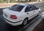 2001 Volvo S40 luxury sedan in polar white, showcasing leather interior and sunny exterior.