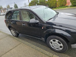 2003 Saturn VUE SUV with 132,000 miles, featuring clean exterior and good fuel efficiency, parked on the street.
