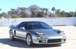 1991 Acura NSX in silver with 31k miles parked against a mountain backdrop in a private lot.