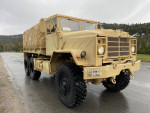 1985 BMY M931A2 military truck with 6x6 wheels parked in a scenic California landscape.