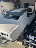 1967 Chevrolet Camaro RS Coupe in garage, ready for restoration and bodywork.