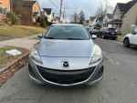 Front view of a 2011 Mazda 3, automatic, with clean exterior and reliable performance, priced at $5,200.