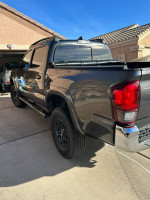 2018 Toyota Tacoma SR5 4WD with 65,000 miles, well maintained with 2-inch lift and TRD Pro grill
