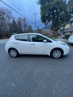 2017 Nissan Leaf S electric vehicle in white, showcasing eco-friendly design and modern features.