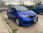 2018 Honda Fit in blue color parked on the street with clean title and low mileage.