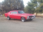 1972 Chevrolet Nova with high compression 350 engine and custom dual exhaust parked outdoors.