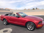 2008 Ford Mustang convertible in red, showing sleek design and well-maintained exterior