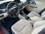 Interior view of a 2013 Honda Accord LX showing clean upholstery and dashboard features.