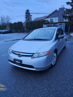 2006 Honda Civic in mint condition with low mileage and new maintenance, parked on a street.