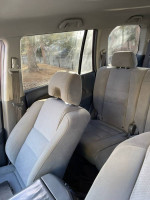 Interior view of a 2008 Honda Pilot with cloth seats and clean dashboard, highlighting low mileage condition.
