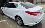 2012 Kia Optima SX with 124,000 miles, white exterior, 18-inch rims, and custom tint.