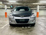 Front view of a 2012 Hyundai Elantra Touring in a parking garage, showcasing its manual transmission and clean design.