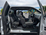 Interior view of a 2005 Ford FX4 4X4 truck showing spacious seating and dashboard.