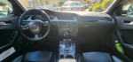 Interior view of a 2011 Audi S4 with modern dashboard and automatic transmission.