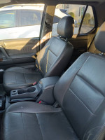 Interior view of a 2001 Honda Passport EX RWD showing worn leather seats and center console